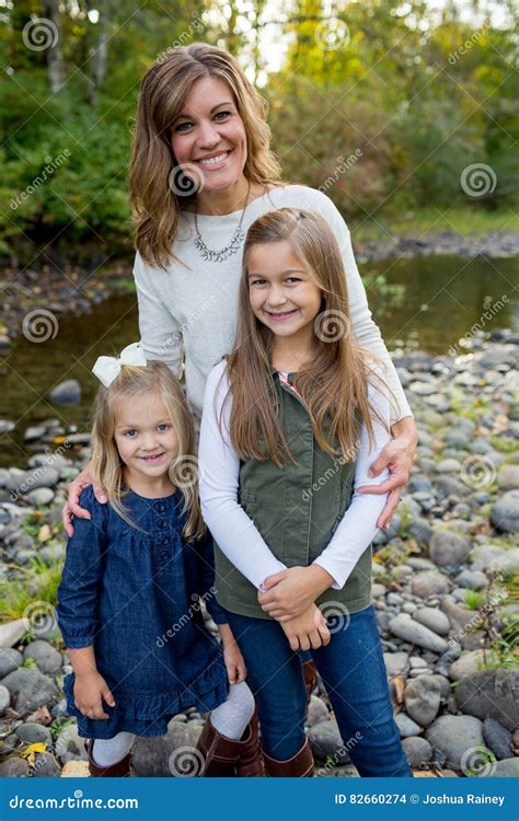 mother with two daughters images